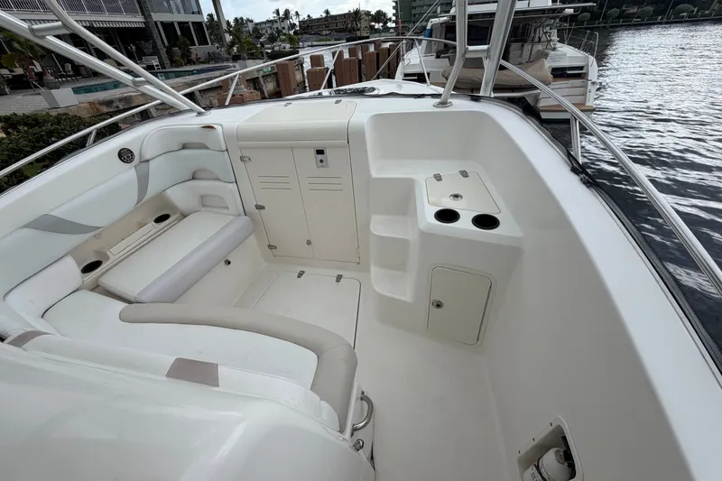 Slide: The Image of 2007 Boston Whaler 320 Outrage boat interior with seating and storage compartments. - 43