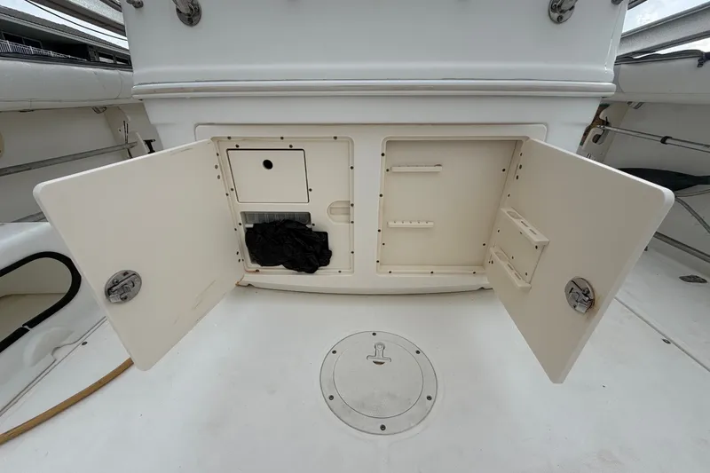 Slide: The Image of Open storage compartment on a 2007 Boston Whaler 320 Outrage boat deck. - 20