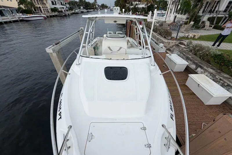 Slide: The Image of 2007 Boston Whaler 320 Outrage docked by a waterfront property. - 12