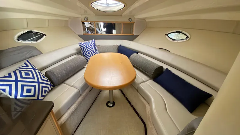 Slide: The Image of Interior of 2015 Monterey 295 Sport Yacht with cozy seating and decorative pillows. - 30