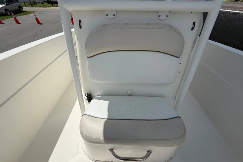 Slide: The Image of 2015 NauticStar 231 Coastal boat seating area with white and beige cushions. - 54