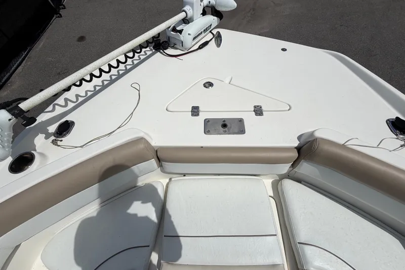 Slide: The Image of 2015 NauticStar 231 Coastal boat deck with seating and trolling motor. - 44