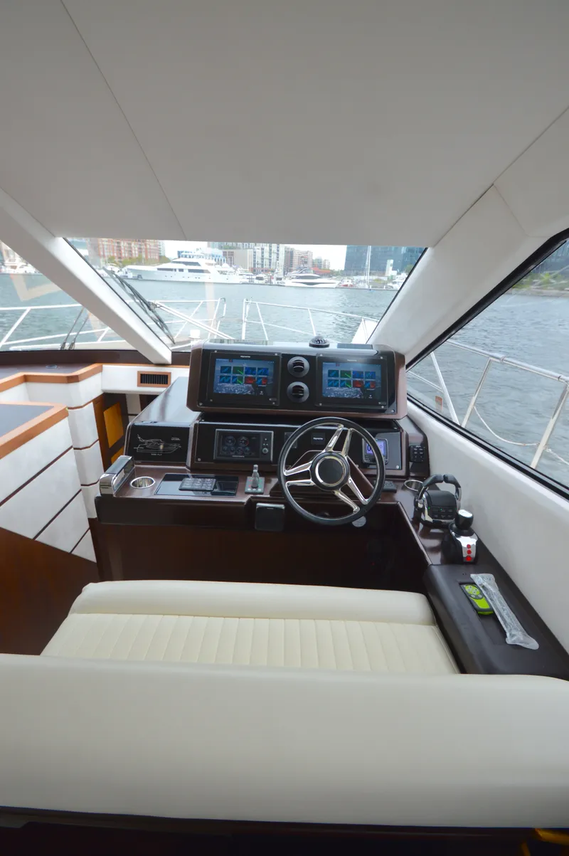 Slide: The Image of Interior view of a 2016 Galeon 550 Fly helm with modern instruments. - 43