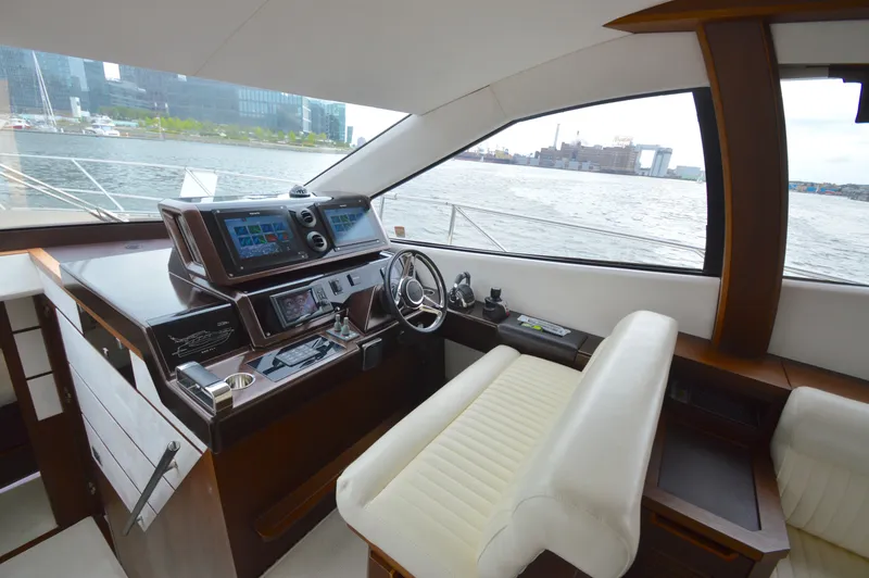 Slide: The Image of Interior view of the 2016 Galeon 550 Fly with modern helm and panoramic windows. - 40