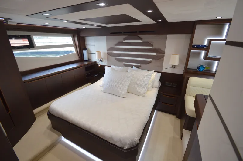 Slide: The Image of Luxurious cabin with a large bed, modern furnishings, and stylish lighting. - 47