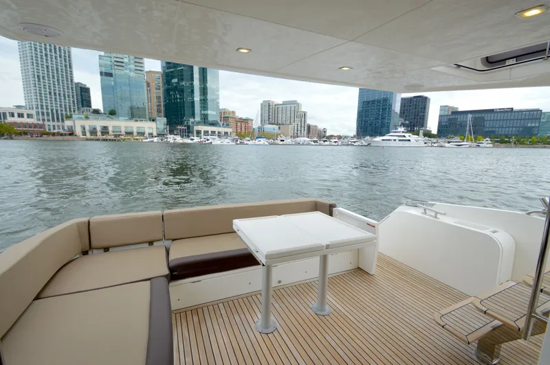 Slide: The Image of The 2016 Galeon 550 Fly features a spacious deck with views of an urban skyline. - 19