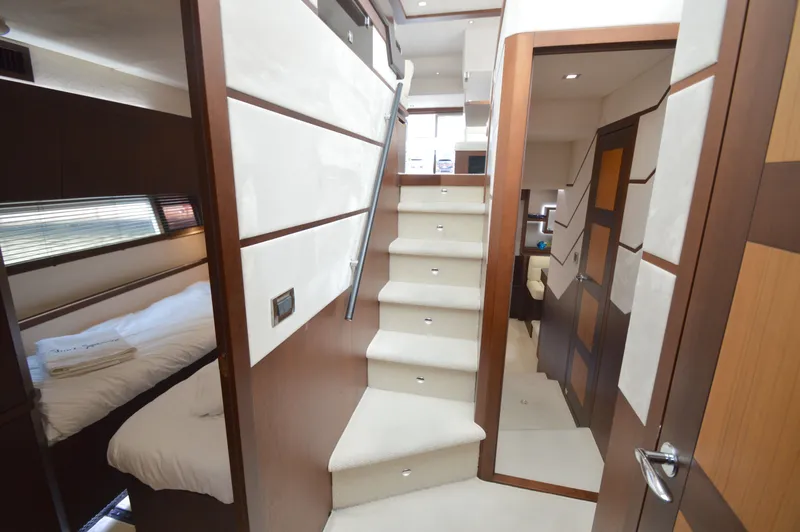 Slide: The Image of Interior of a 2016 Galeon 550 Fly with stairs and sleeping area. - 45