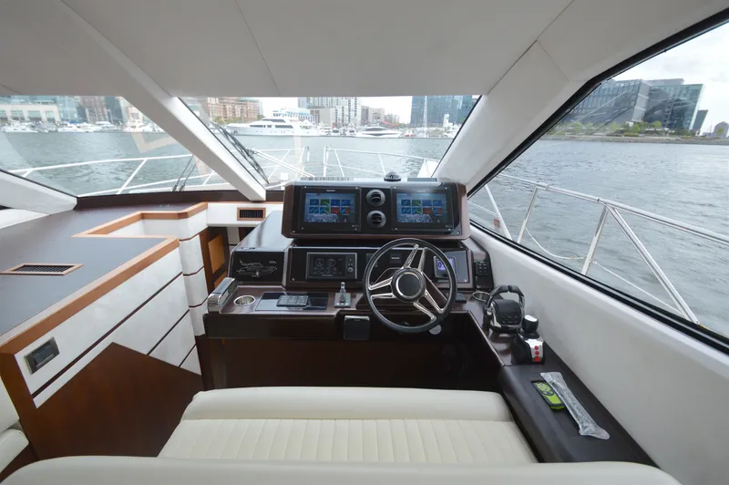 Slide: The Image of Interior view of a 2016 Galeon 550 Fly helm with modern navigation system. - 42