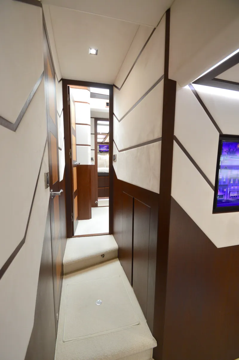 Slide: The Image of A sleek hallway with modern wood paneling and soft lighting. - 46