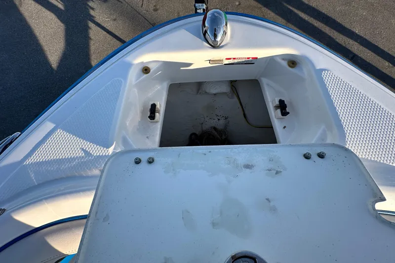 Slide: The Image of 2017 Chaparral Vortex 203 VRX boat bow storage compartment, open and empty. - 83