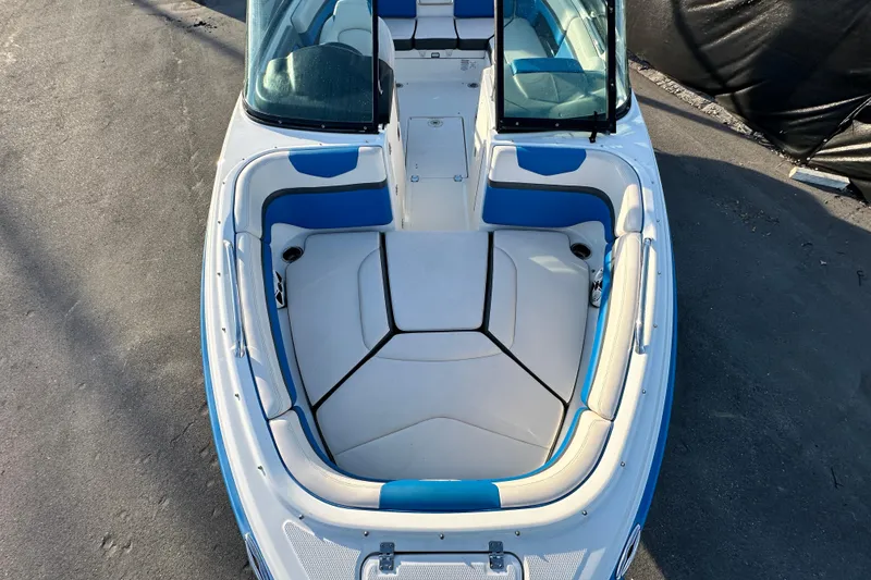 Slide: The Image of 2017 Chaparral Vortex 203 VRX boat interior with blue and white seating. - 30