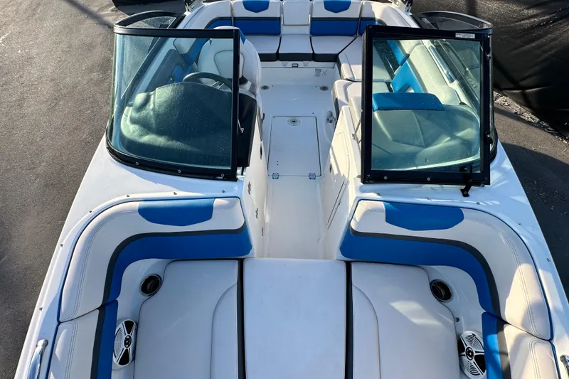 Slide: The Image of 2017 Chaparral Vortex 203 VRX boat interior with blue and white seating. - 32