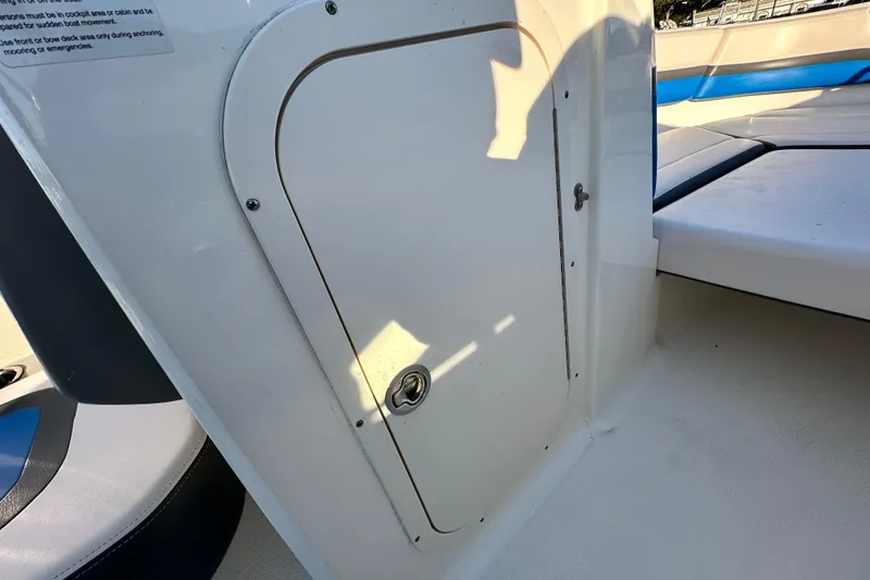 Slide: The Image of 2017 Chaparral Vortex 203 VRX boat interior with storage compartment and seating. - 70