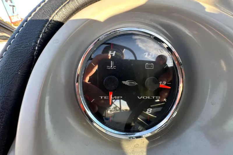 Slide: The Image of Close-up of 2017 Chaparral Vortex 203 VRX dashboard gauge showing temperature and voltage. - 21