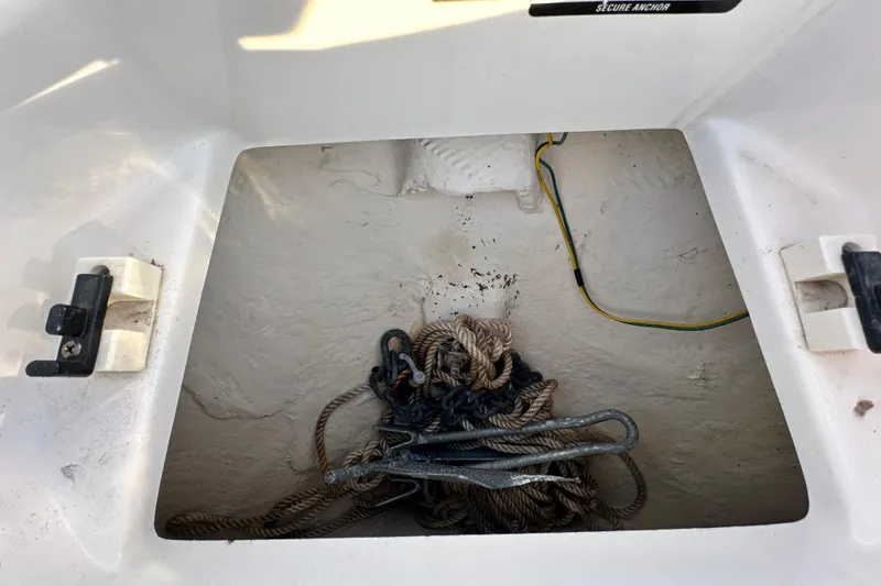 Slide: The Image of Storage compartment with ropes in a 2017 Chaparral Vortex 203 VRX boat. - 84
