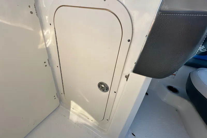 Slide: The Image of 2017 Chaparral Vortex 203 VRX interior storage compartment with lock. - 75