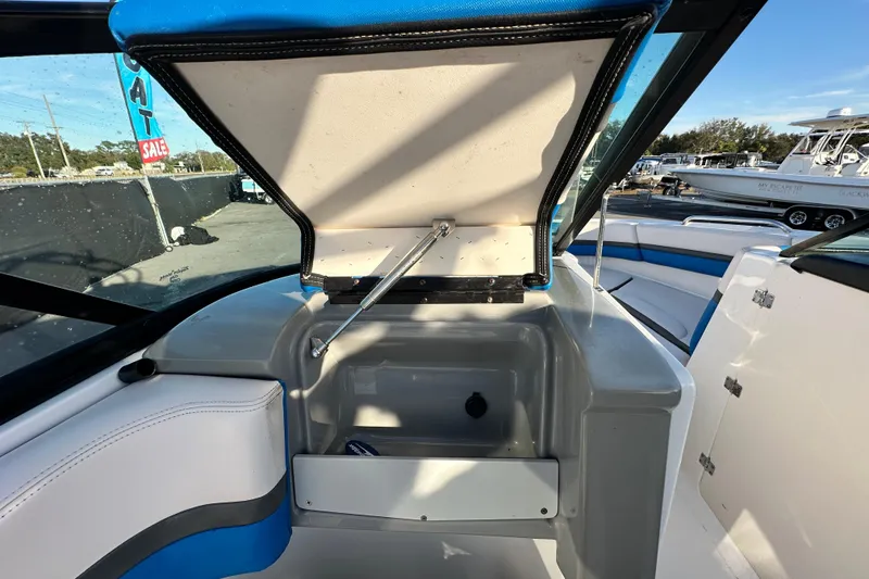 Slide: The Image of 2017 Chaparral Vortex 203 VRX boat interior storage compartment open. - 65