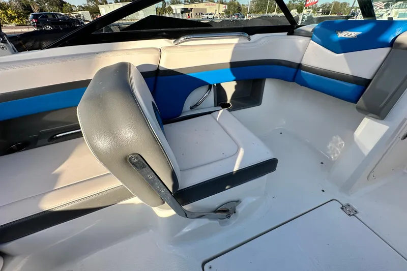 Slide: The Image of 2017 Chaparral Vortex 203 VRX boat interior with blue and gray seating. - 59