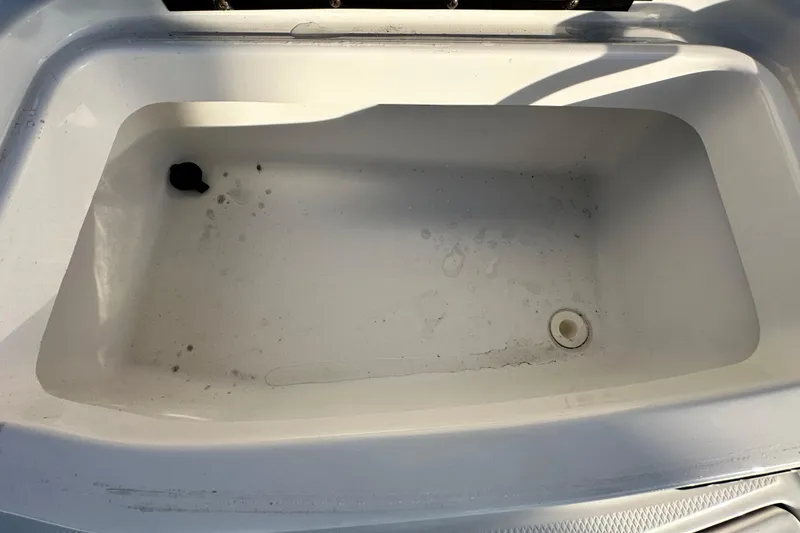 Slide: The Image of 2017 Chaparral Vortex 203 VRX boat storage compartment, empty and slightly dirty. - 43