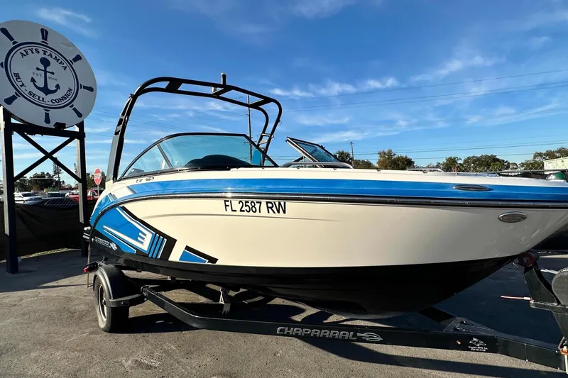 The Image of 2017 Chaparral Vortex 203 VRX boat on trailer, parked outdoors under clear sky. - 0