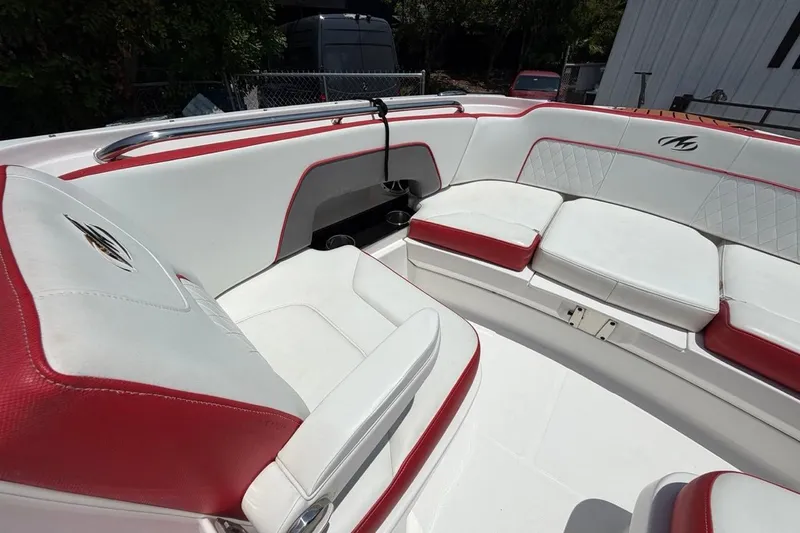 Slide: The Image of Luxurious seating on a 2017 Monterey M-65 boat with red and white upholstery. - 86