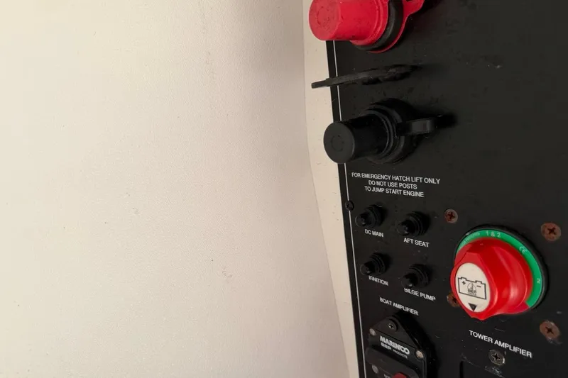 Slide: The Image of Control panel of a 2017 Monterey M-65 boat with emergency hatch instructions. - 106