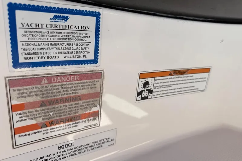 Slide: The Image of Yacht certification and safety warnings on a 2017 Monterey M-65 boat. - 109