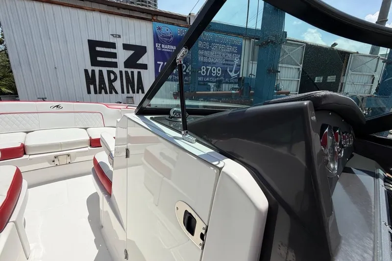 Slide: The Image of 2017 Monterey M-65 boat interior with red and white seating at EZ Marina. - 82