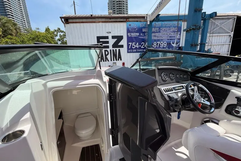 Slide: The Image of Interior of a 2017 Monterey M-65 boat showing helm and cabin area. - 77