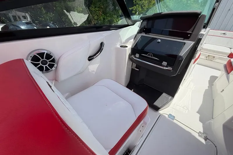 Slide: The Image of Interior of a 2017 Monterey M-65 boat with red and white seating. - 64