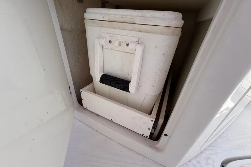 Slide: The Image of Storage compartment with cooler on a 2017 Monterey M-65 boat. - 60