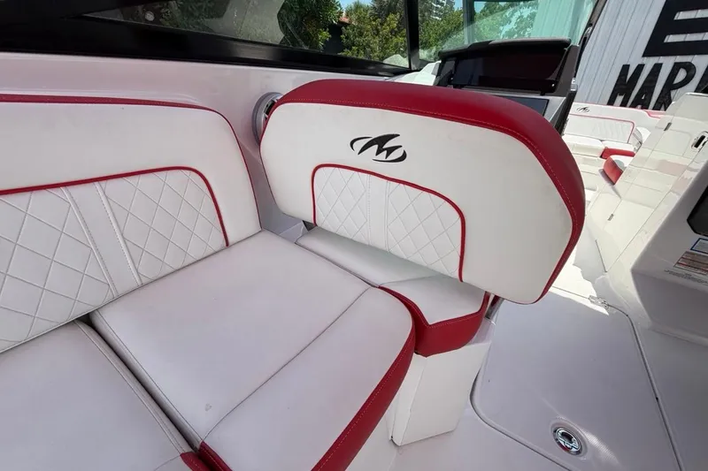 Slide: The Image of Luxurious white and red seating on a 2017 Monterey M-65 boat interior. - 57