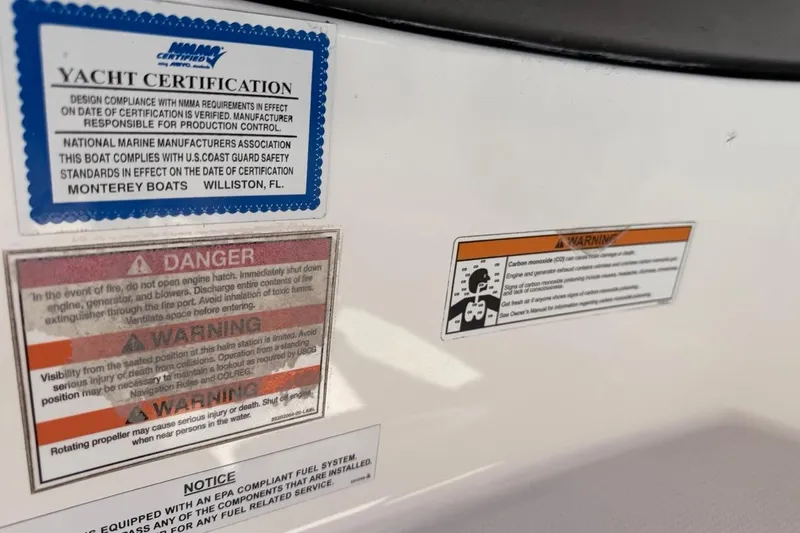 Slide: The Image of Yacht certification and safety warnings on a 2017 Monterey M-65 boat. - 110