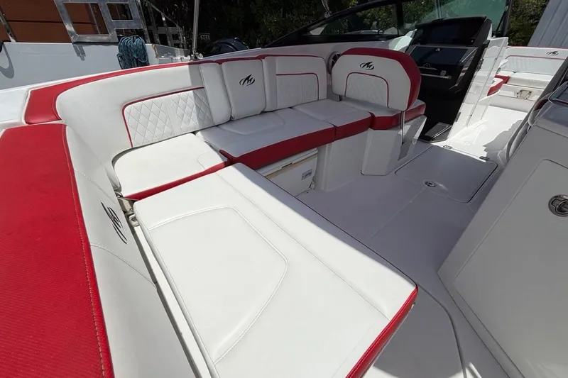 Slide: The Image of Luxurious seating on a 2017 Monterey M-65 boat with red and white upholstery. - 54