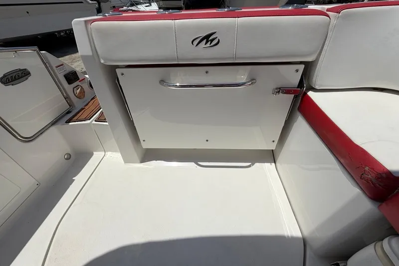 Slide: The Image of Interior of a 2017 Monterey M-65 boat with white and red seating. - 104