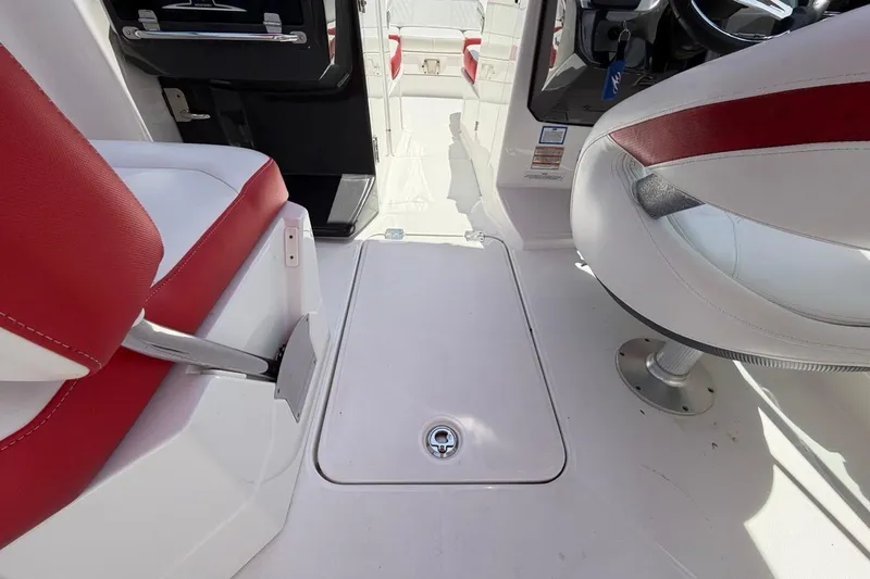 Slide: The Image of Interior of 2017 Monterey M-65 boat with red and white seating. - 62