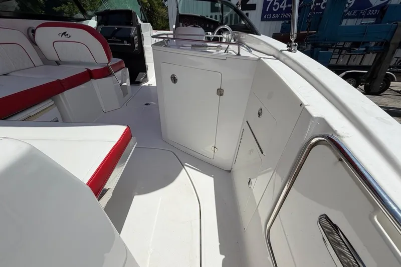 Slide: The Image of Interior of a 2017 Monterey M-65 boat with red and white seating. - 53