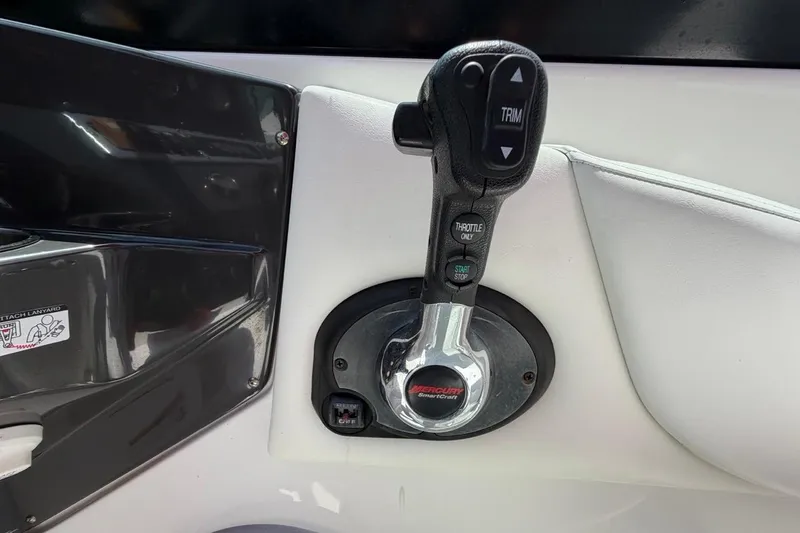 Slide: The Image of Throttle control lever on a 2017 Monterey M-65 boat dashboard. - 80