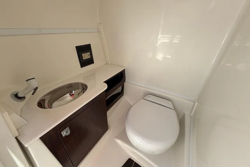Slide: The Image of Compact bathroom in 2017 Monterey M-65 boat with sink and toilet. - 76