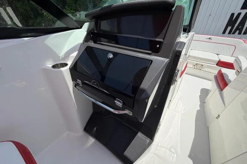 Slide: The Image of 2017 Monterey M-65 boat interior with sleek seating and modern dashboard design. - 71