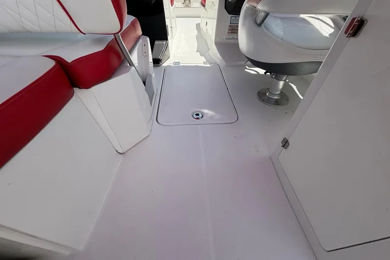 Slide: The Image of Interior of a 2017 Monterey M-65 boat with red and white seating. - 61