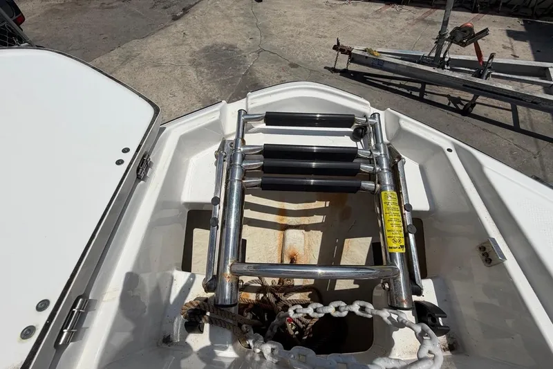 Slide: The Image of 2017 Monterey M-65 boat ladder and anchor storage area. - 91
