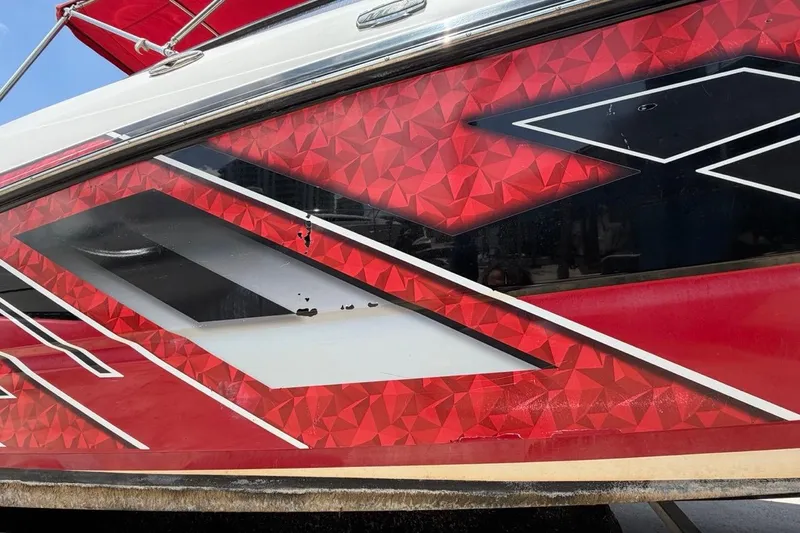 Slide: The Image of Red and black geometric design on 2017 Monterey M-65 boat exterior. - 26