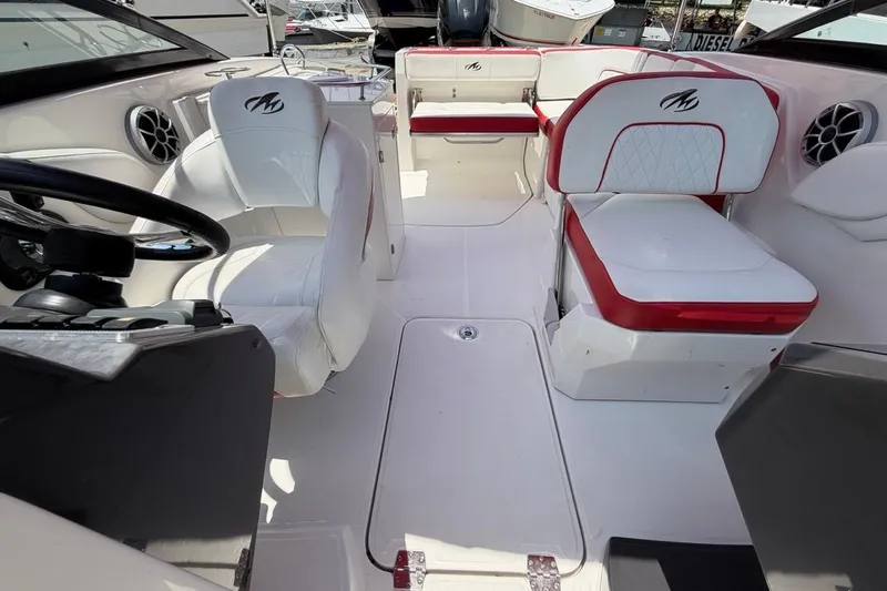 Slide: The Image of Interior of a 2017 Monterey M-65 boat with white and red seating. - 97