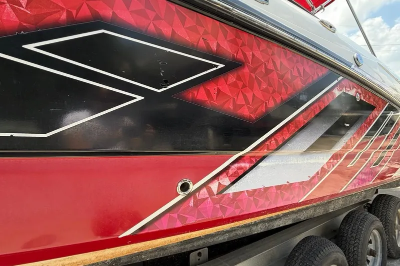 Slide: The Image of Red and black geometric design on 2017 Monterey M-65 boat hull. - 46