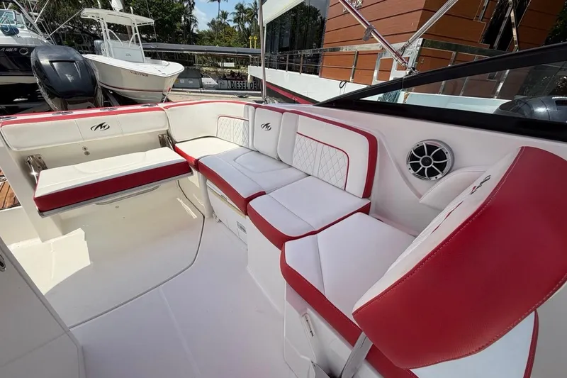 Slide: The Image of Luxurious seating on a 2017 Monterey M-65 boat with red and white upholstery. - 102