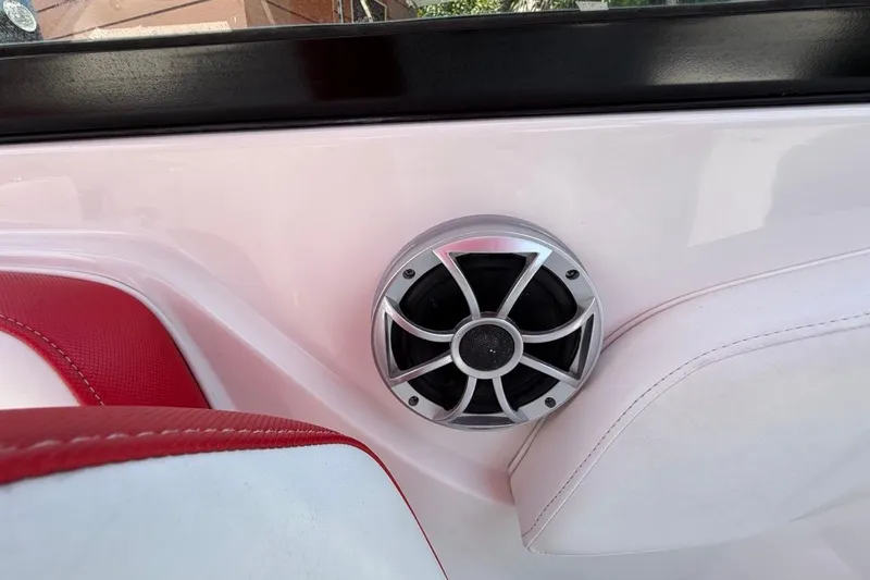 Slide: The Image of Boat interior with red and white seating, featuring a speaker on a Monterey M-65, 2017 model. - 78
