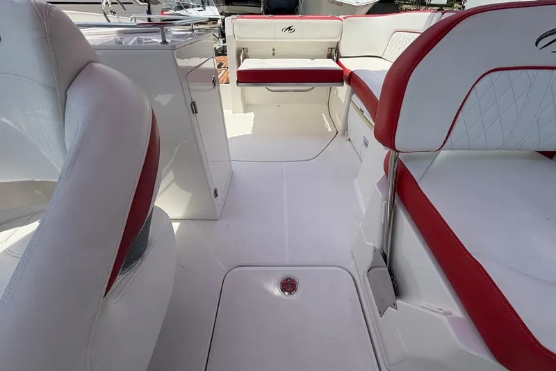 Slide: The Image of Interior of a 2017 Monterey M-65 boat with white and red seating. - 98