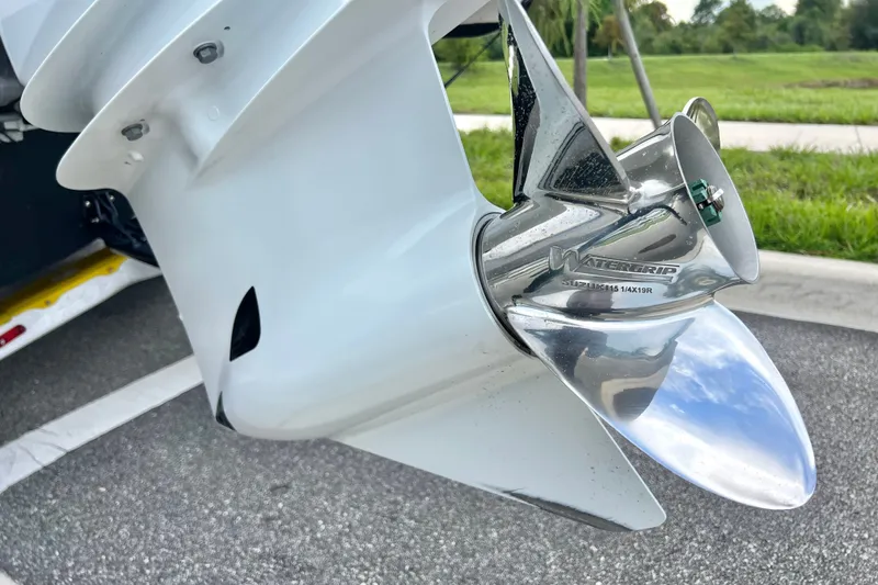 Slide: The Image of Close-up of a 2017 Pursuit C 238 Center Console boat propeller on pavement. - 12