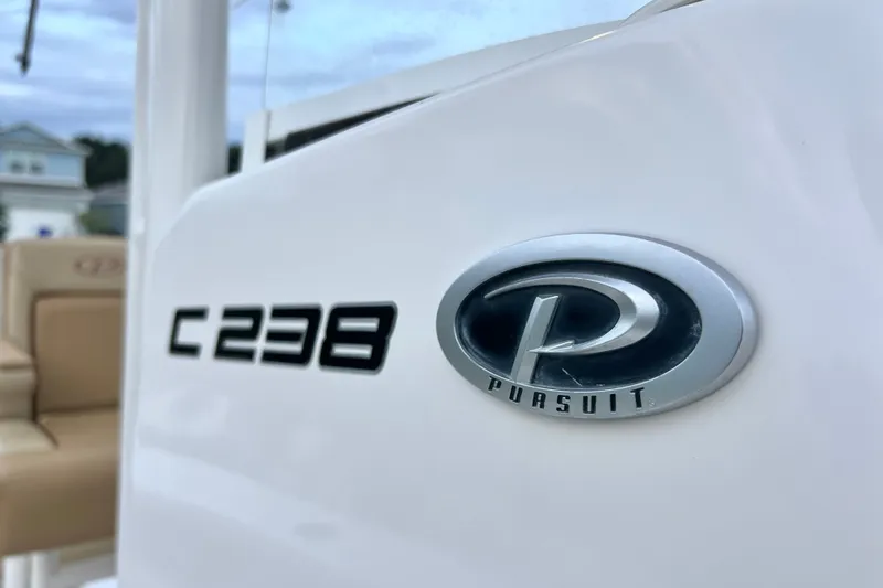 Slide: The Image of 2017 Pursuit C 238 Center Console boat emblem and logo detail. - 86
